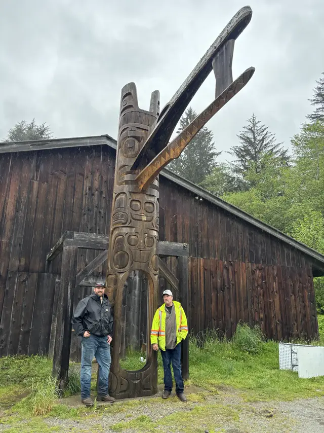 Steel support for a carved pole