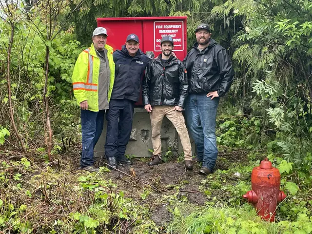 JBones crew with community members beside a newly installed fire box